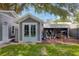 Charming outbuilding with gray siding and double doors, adding extra space and functionality to the property at 216 Freeman St, Mount Pleasant, SC 29464