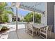 Inviting outdoor dining area with a lovely pool view, ideal for entertaining in a relaxing atmosphere at 216 Freeman St, Mount Pleasant, SC 29464