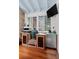 Outdoor kitchen featuring pizza oven, BBQ grill, mini fridge, and granite countertop at 216 Freeman St, Mount Pleasant, SC 29464