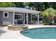 Pool house featuring an outdoor bar with seating, dining area, and a relaxing waterfall spa at 216 Freeman St, Mount Pleasant, SC 29464
