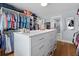Spacious walk-in closet with custom shelving, drawers, and ample hanging space for organized storage solutions at 216 Freeman St, Mount Pleasant, SC 29464