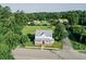 Aerial view of beautiful home with a metal roof, large yard, and surrounding greenery at 21877 Lowcountry Hwy, Ruffin, SC 29475