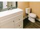 Well-lit bathroom featuring a modern vanity with drawers and wood-style floors at 21877 Lowcountry Hwy, Ruffin, SC 29475
