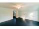 Large bedroom with light blue walls, black painted floors, and a ceiling fan at 21877 Lowcountry Hwy, Ruffin, SC 29475