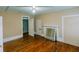 Bedroom with hardwood floors and view through to another room at 21877 Lowcountry Hwy, Ruffin, SC 29475