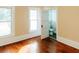 Bedroom with hardwood floors, light walls, and a peek into the attached bathroom at 21877 Lowcountry Hwy, Ruffin, SC 29475