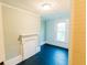 Cozy bedroom with blue walls, black floors, a window providing natural light, and a decorative fireplace at 21877 Lowcountry Hwy, Ruffin, SC 29475