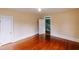 Bedroom with shiny hard wood floors and a view into the stairwell at 21877 Lowcountry Hwy, Ruffin, SC 29475