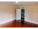 Bedroom with shiny hard wood floors and a view into the stairwell at 21877 Lowcountry Hwy, Ruffin, SC 29475