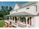 Charming two-story home with a welcoming front porch and a metal roof at 21877 Lowcountry Hwy, Ruffin, SC 29475