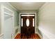 Entryway with beautiful front door, wood floors, and light-colored walls at 21877 Lowcountry Hwy, Ruffin, SC 29475