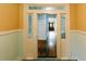 Hallway featuring wood floors and door view to beautiful front door at 21877 Lowcountry Hwy, Ruffin, SC 29475