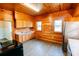Wooden kitchen with stainless steel appliances, wood cabinets, and two windows at 21877 Lowcountry Hwy, Ruffin, SC 29475