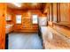 Charming kitchen features wood paneling, granite countertops, and stainless-steel appliances at 21877 Lowcountry Hwy, Ruffin, SC 29475