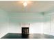 Living room featuring a fireplace, light walls, and stunning dark hardwood floors at 21877 Lowcountry Hwy, Ruffin, SC 29475