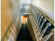 Staircase leading to lower level with white railings at 21877 Lowcountry Hwy, Ruffin, SC 29475