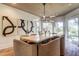 Contemporary dining room featuring a modern chandelier, large table, and unique art at 2414 Goldbug Ave, Sullivans Island, SC 29482