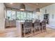 Bright kitchen with an island, modern appliances, and ample cabinet space with hardwood floors at 2414 Goldbug Ave, Sullivans Island, SC 29482