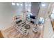 Open-concept living room with soaring ceilings, modern decor, and a cozy fireplace at 2414 Goldbug Ave, Sullivans Island, SC 29482