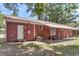 Brick home showing the backyard, a door, and the air conditioning unit at 245 Clarine Dr, Goose Creek, SC 29445