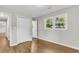 Bright bedroom featuring hardwood floors, natural light from the large windows, and closet for storage at 245 Clarine Dr, Goose Creek, SC 29445