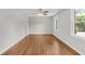 Spacious bedroom showcasing hardwood floors, natural light, and a modern ceiling fan at 245 Clarine Dr, Goose Creek, SC 29445