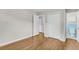 Cozy bedroom featuring hardwood floors, a closet, and a doorway leading to the bathroom at 245 Clarine Dr, Goose Creek, SC 29445