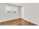 This bedroom features hardwood floors, a window letting in natural light, and a closet for storage at 245 Clarine Dr, Goose Creek, SC 29445