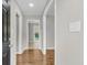 Bright hallway featuring fresh paint, modern lighting, and hardwood floors throughout at 245 Clarine Dr, Goose Creek, SC 29445