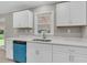 Bright kitchen features white cabinets, stainless steel sink, light countertops, and a modern, updated design at 245 Clarine Dr, Goose Creek, SC 29445