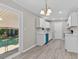 Modern kitchen boasting white cabinets, stainless steel appliances, and luxury vinyl plank flooring at 245 Clarine Dr, Goose Creek, SC 29445