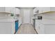 Open kitchen featuring white cabinets, stainless steel appliances, light countertops, and modern flooring at 245 Clarine Dr, Goose Creek, SC 29445