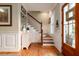 Inviting entryway features natural light, wood floors, and wood staircase at 2705 Parkers Landing Rd, Mount Pleasant, SC 29466