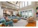 Spacious living room with vaulted ceiling, balcony, and multiple windows allowing natural light to accent a comfortable space at 2705 Parkers Landing Rd, Mount Pleasant, SC 29466