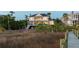 Inviting rear exterior featuring a covered porch, outdoor seating, and scenic views at 2705 Parkers Landing Rd, Mount Pleasant, SC 29466