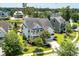 Aerial view of beautiful home, mature trees, manicured yard, and in a serene neighborhood with a nearby pond at 3028 River Vista Drive Way, Mount Pleasant, SC 29466