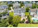 Aerial view of beautiful neighborhood home with outdoor kitchen, screened porch and lush landscaping at 3028 River Vista Drive Way, Mount Pleasant, SC 29466