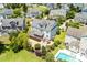 Aerial view of a well-maintained home, pool, patio area, and manicured landscaping at 3028 River Vista Drive Way, Mount Pleasant, SC 29466