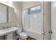 Bright bathroom featuring a single sink vanity, toilet, and tub with white tile surround at 3028 River Vista Drive Way, Mount Pleasant, SC 29466