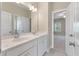 Bright bathroom featuring a double sink vanity with a white marble countertop and modern fixtures at 3028 River Vista Drive Way, Mount Pleasant, SC 29466