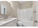 Bathroom with white vanity, sink, mirror, and tub/shower combo with tile surround at 3028 River Vista Drive Way, Mount Pleasant, SC 29466