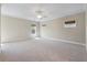 Bright bedroom with large windows, ceiling fan, and neutral carpeting at 3028 River Vista Drive Way, Mount Pleasant, SC 29466