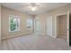 A bedroom with two windows and two entry doors, showing access to other rooms at 3028 River Vista Drive Way, Mount Pleasant, SC 29466