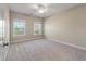 Bedroom with two large windows allowing for natural light and neutral carpeting at 3028 River Vista Drive Way, Mount Pleasant, SC 29466