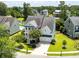 Aerial view of a charming two story home with a well-manicured front yard and a two car garage at 3028 River Vista Drive Way, Mount Pleasant, SC 29466