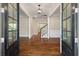 Home foyer features hardwood floors, staircase, and a view into the adjacent rooms at 3028 River Vista Drive Way, Mount Pleasant, SC 29466