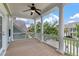 Front balcony with decorative white railing and columns with a view of the neighborhood at 3028 River Vista Drive Way, Mount Pleasant, SC 29466