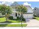 Beautiful two-story home with a spacious front porch, manicured lawn, and attached two-car garage at 3028 River Vista Drive Way, Mount Pleasant, SC 29466