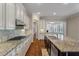 Modern kitchen boasts granite countertops, stainless steel appliances, and gas range at 3028 River Vista Drive Way, Mount Pleasant, SC 29466