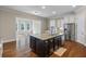 Kitchen island with breakfast bar, stainless steel sink, and stainless steel appliances at 3028 River Vista Drive Way, Mount Pleasant, SC 29466